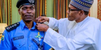 President Muhammadu Buhari decorates new IGP Mohammed Adamu