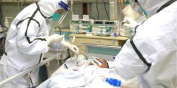 Medical staff in protective suits treat a patient with pneumonia caused by Coronavirus in Wuhan, Hubei province of China