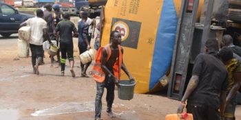 Lockdown: Youths storm tanker accident scene, scoop fuel