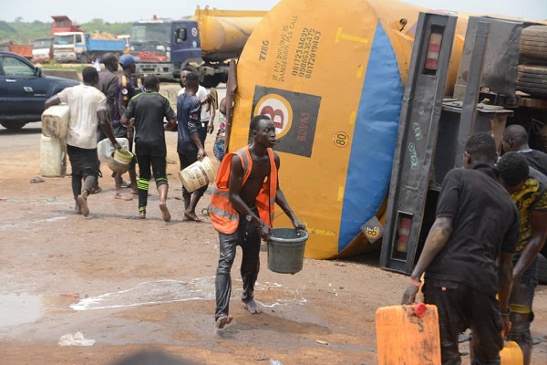 Lockdown: Youths storm tanker accident scene, scoop fuel