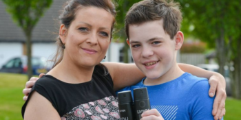 Kacper Krauze with his mother holding Lynx deodorant