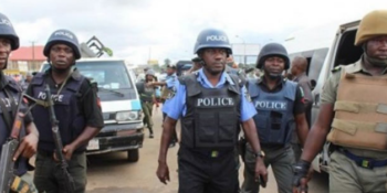 File photo: Policemen at a crime scene