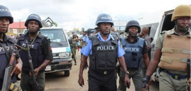 File photo: Policemen at a crime scene