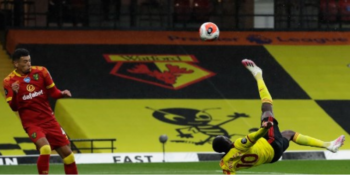 Watford's English striker Danny Welbeck (R) hits an overhead kick and scores his team's second goal during the English Premier League football match between Watford and Norwich City at Vicarage Road Stadium in Watford, north of London, on July 7, 2020.