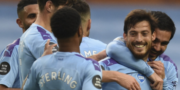 Manchester City's Spanish midfielder David Silva (2R) celebrates scoring their fourth goal during the English Premier League football match between Manchester City and Newcastle United at the Etihad Stadium in Manchester.