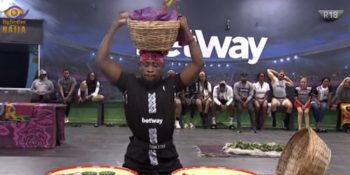 BBNaija 2020 Day 26: Trikytee carrying a basket on his head during the Betway Arena Games - Trikytee