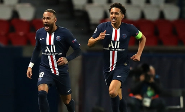 Paris Saint-Germain's Brazilian forward Neymar (L) celebrating with Paris Saint-Germain's Brazilian defender Marquinhos after scoring a goal during the UEFA Champions League round-of-16 second leg football match between Paris Saint-Germain (PSG) and Borussia Dortmund at the Parc des Princes stadium in Paris.