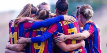 Barcelona women's players celebrating a goal against Real Madrid
