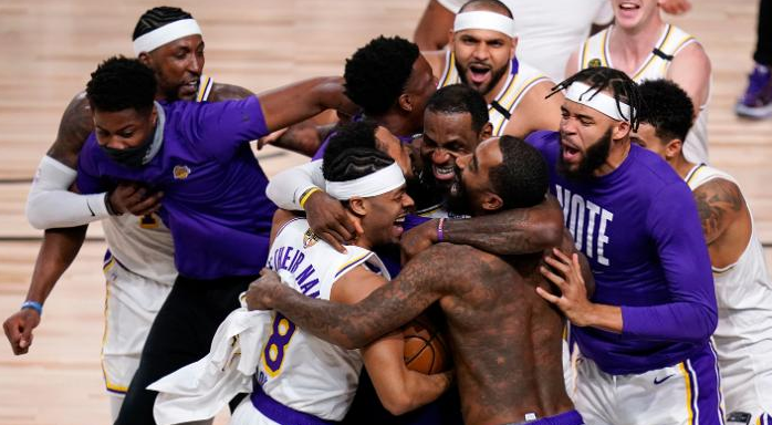 The Los Angeles Lakers celebrate after defeating the Miami Heat 106-93 in Game 6 of the NBA Finals, winning the franchise's 17th title.