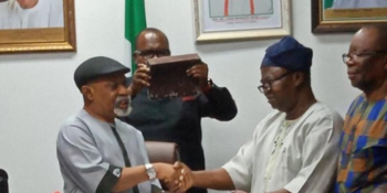 The Minister of Labour and Employment, Senator Chris Ngige shakes hands with the President of the Academic Staff Union of Universities (ASUU)