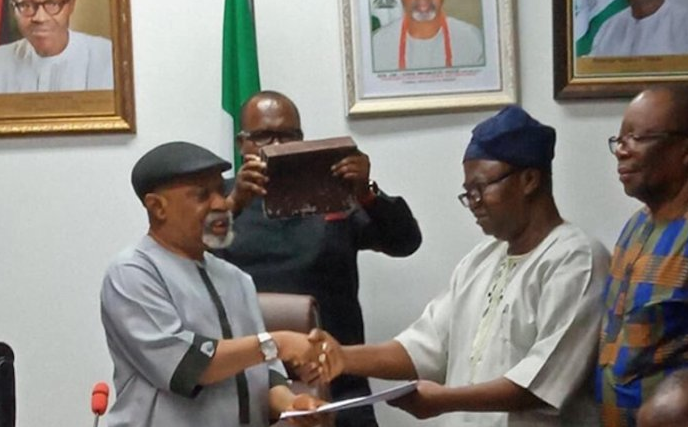 The Minister of Labour and Employment, Senator Chris Ngige shakes hands with the President of the Academic Staff Union of Universities (ASUU)