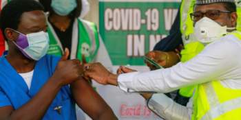 Dr Ngong Cyprian receives his first dose of the Oxford/AstraZeneca coronavirus disease (COVID-19) vaccine from Dr Faisal Shuaib, Executive Director and Chief Executive Officer of the National Primary Health Care Development Agency, at the National hospital in Abuja, Nigeria, March 5, 2021.