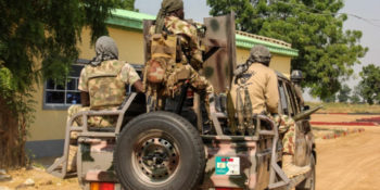 Armed bandits in army uniform